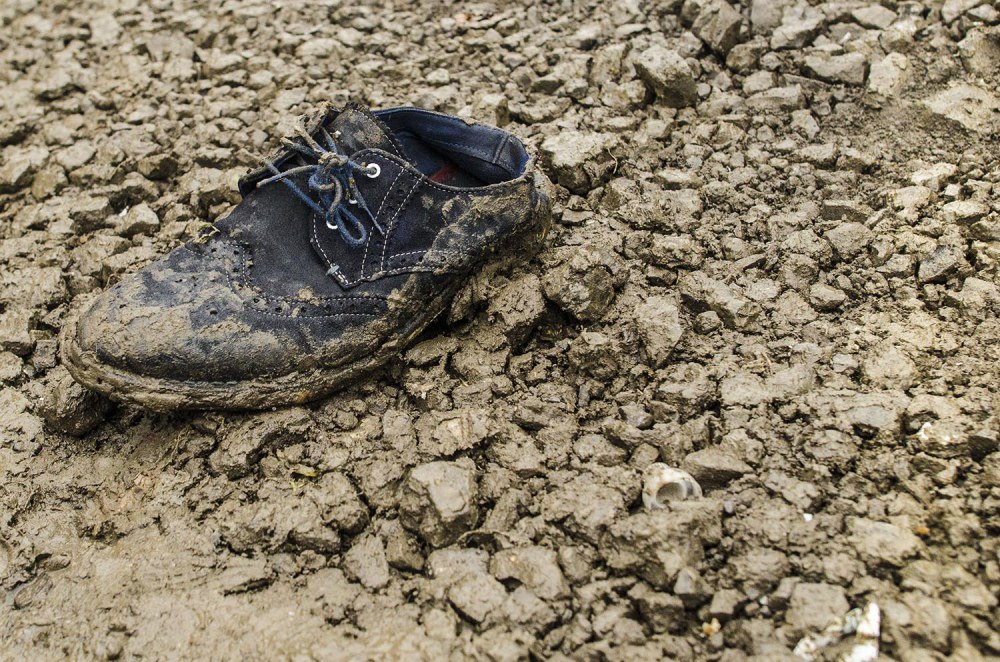 Most donations are well-meaning but very few shoes that are suited for the conditions. Grande-Synthe camp, Dunkirk, France. December 2015